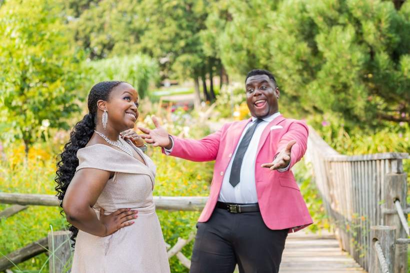 Groom in a pink jacket with his bride